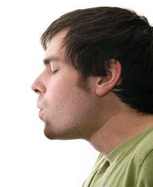 person breathing deeply