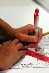 hands holding drafting pen