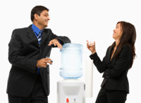 Two people talking at water coooler